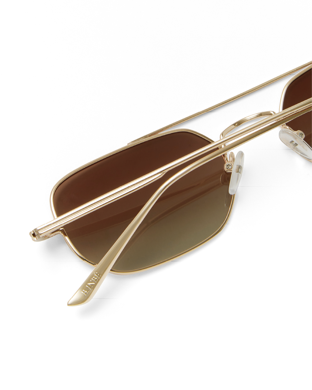 Women's sunglasses with metal gold frame, double bridge design and tinted lenses