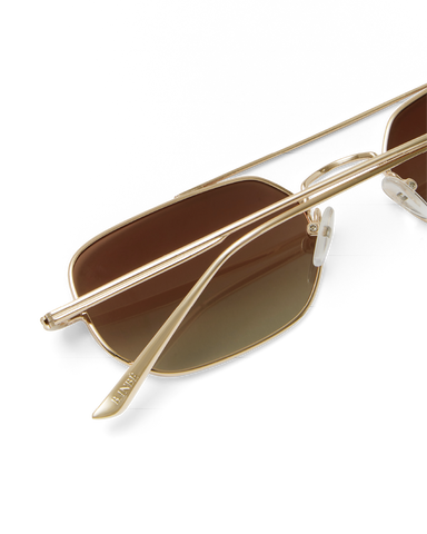 Women's sunglasses with metal gold frame, double bridge design and tinted lenses