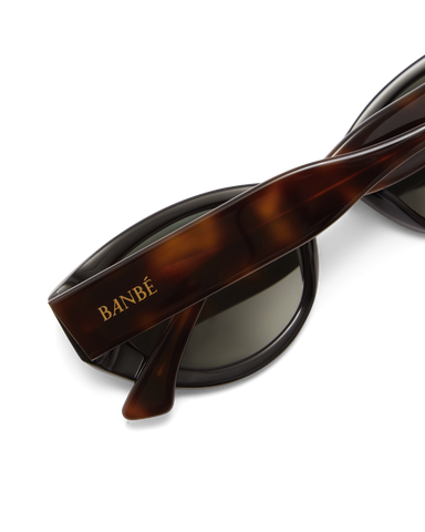Women’s tortoiseshell cat-eye sunglasses with chunky acetate frame, tinted lenses