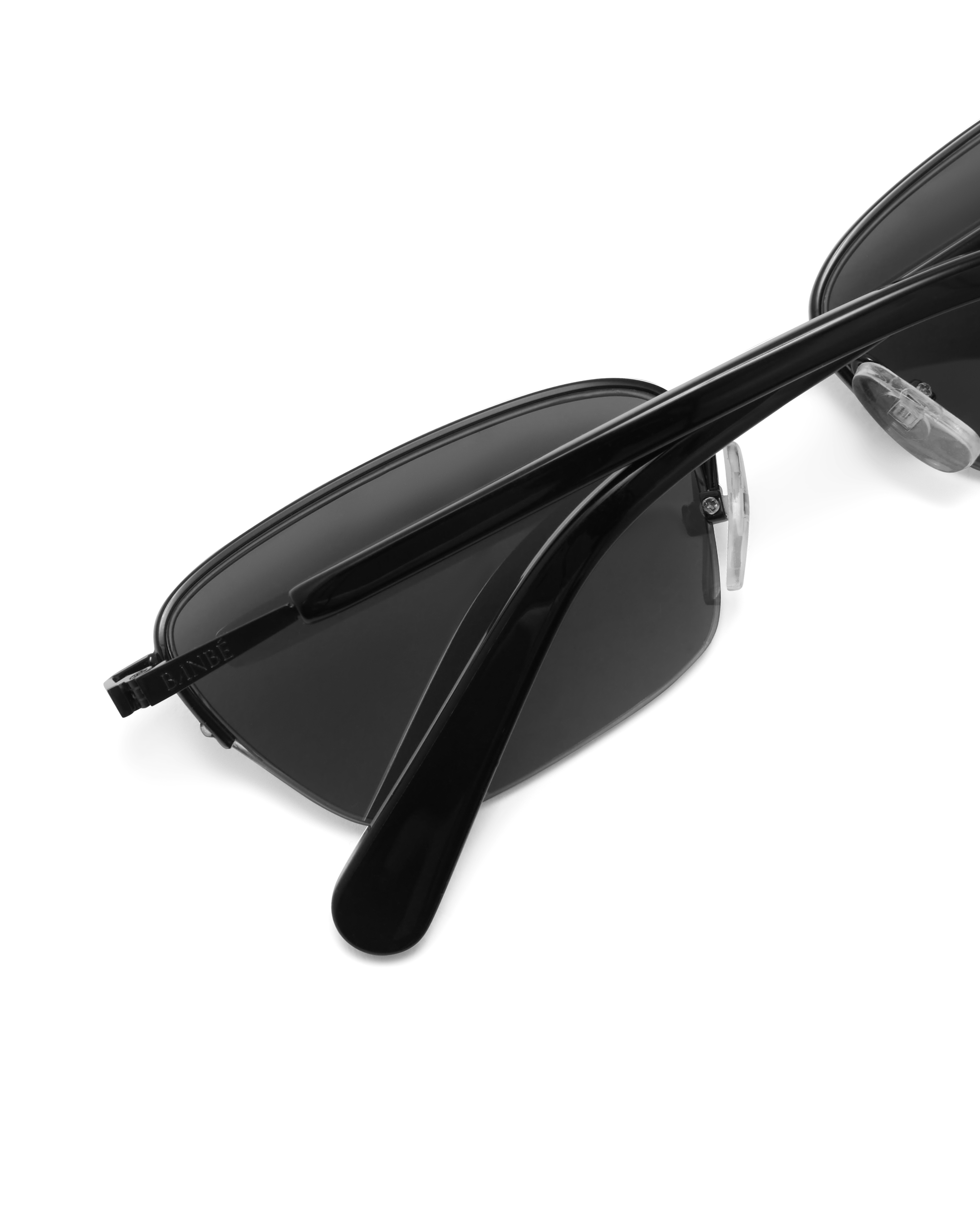 Women’s metal cat-eye sunglasses with UV protection, thin frame, dark tinted lenses, close view