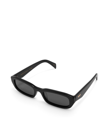 Women's sunglasses with a rectangular silhouette, chunky acetate frame, tonal tinted lenses, and wide arms for a bold, modern look with UV protection.