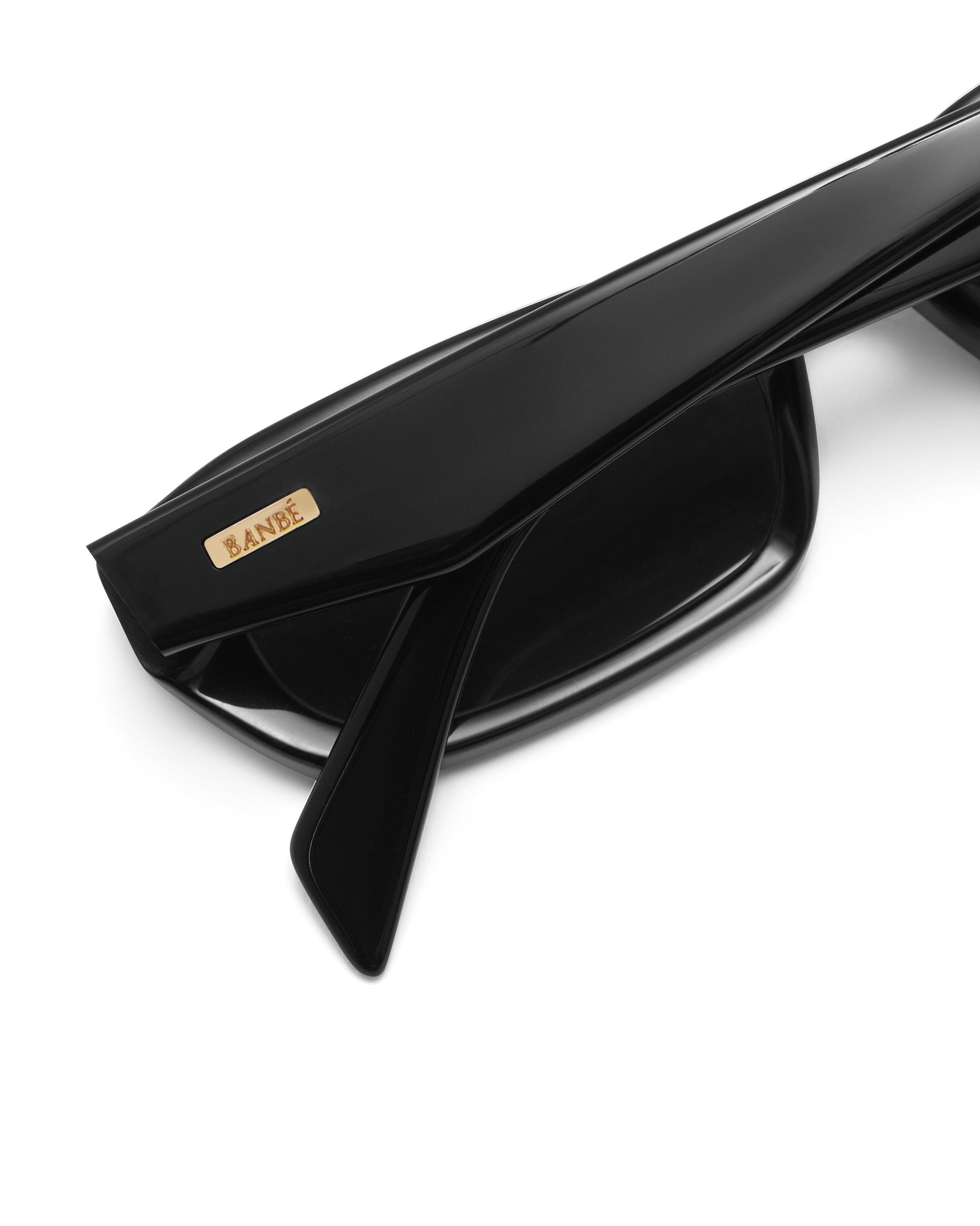 Women's sunglasses with a rectangular silhouette, chunky acetate frame, tonal tinted lenses, and wide arms for a bold, modern look with UV protection.